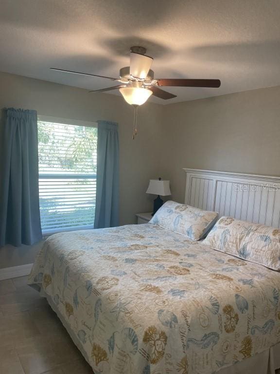 bedroom featuring ceiling fan