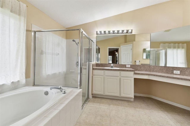 bathroom featuring lofted ceiling, vanity, plenty of natural light, and separate shower and tub