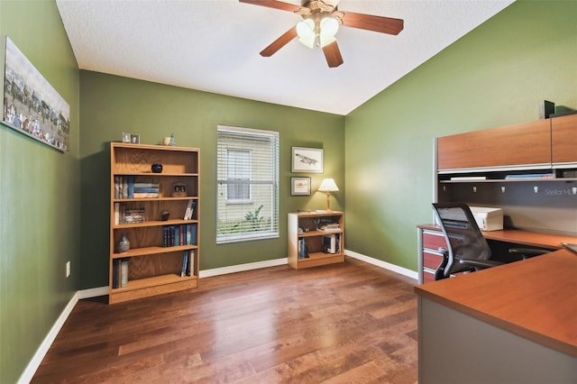 office space featuring lofted ceiling, dark hardwood / wood-style flooring, and ceiling fan