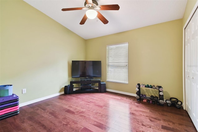 interior space featuring wood-type flooring, vaulted ceiling, and ceiling fan