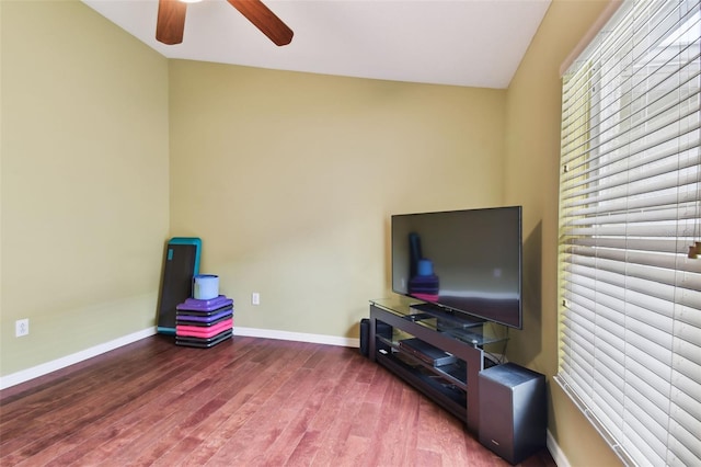 interior space featuring lofted ceiling, hardwood / wood-style flooring, and ceiling fan