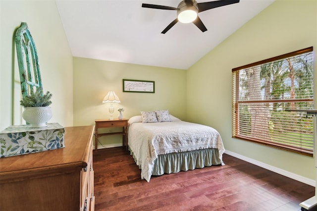 bedroom featuring dark wood-type flooring, ceiling fan, and lofted ceiling