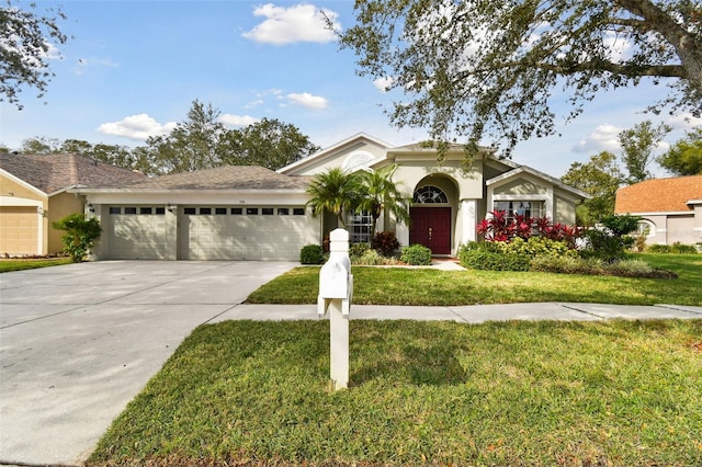 view of front of property featuring a garage and a front yard