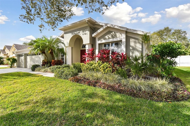 view of front of home with a garage and a front yard