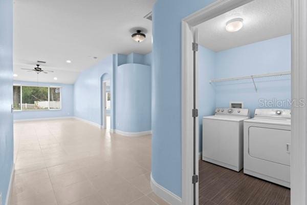 washroom with ceiling fan and washing machine and dryer