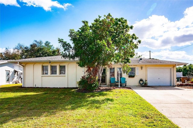 single story home featuring a garage and a front yard