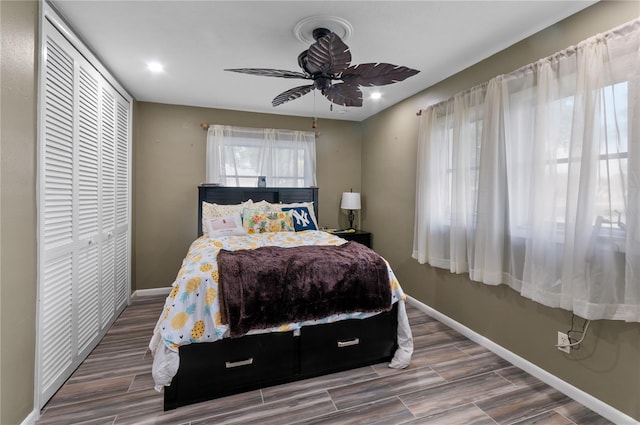 bedroom featuring ceiling fan and a closet