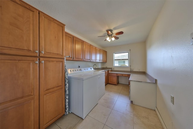 washroom with cabinets, ceiling fan, sink, light tile patterned floors, and independent washer and dryer