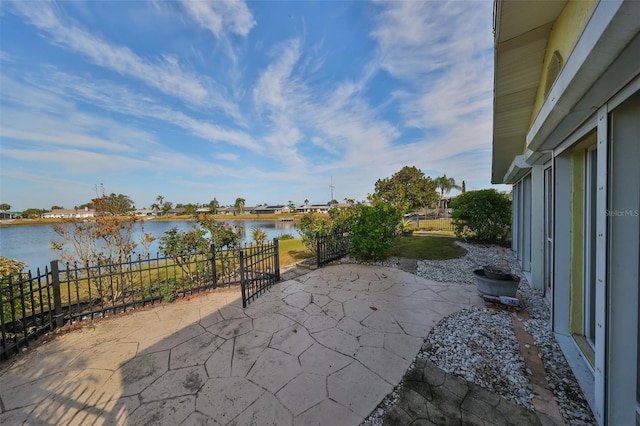 view of patio with a water view