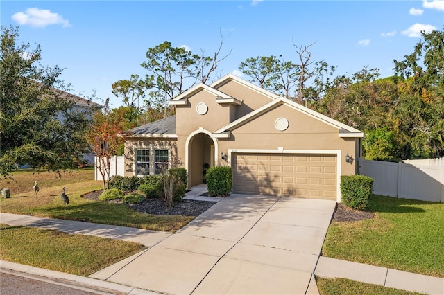 view of front of home with a front lawn and a garage