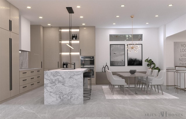 interior space featuring light stone countertops, high end refrigerator, double wall oven, and hanging light fixtures