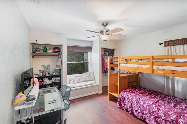 bedroom featuring dark hardwood / wood-style floors and ceiling fan