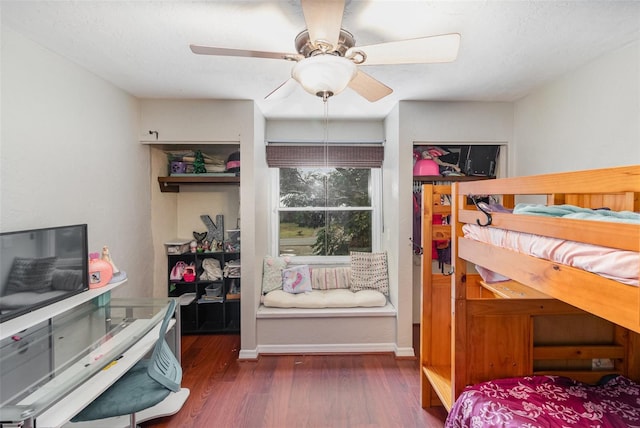 bedroom featuring dark hardwood / wood-style flooring and ceiling fan