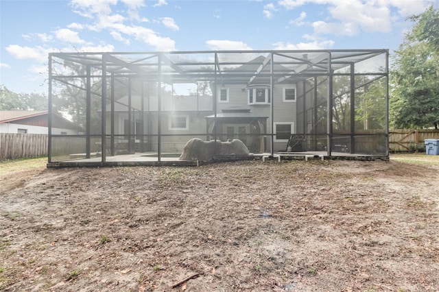 rear view of house with a lanai and a patio area