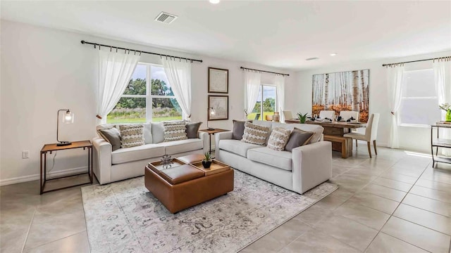 tiled living room with plenty of natural light