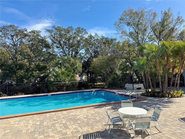 view of swimming pool featuring a patio