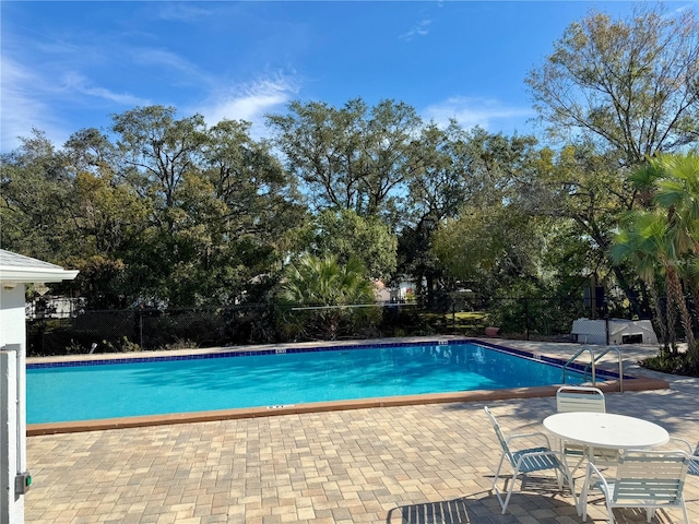 view of swimming pool featuring a patio