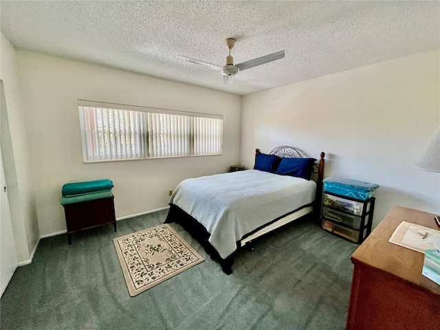 carpeted bedroom with a textured ceiling and a ceiling fan