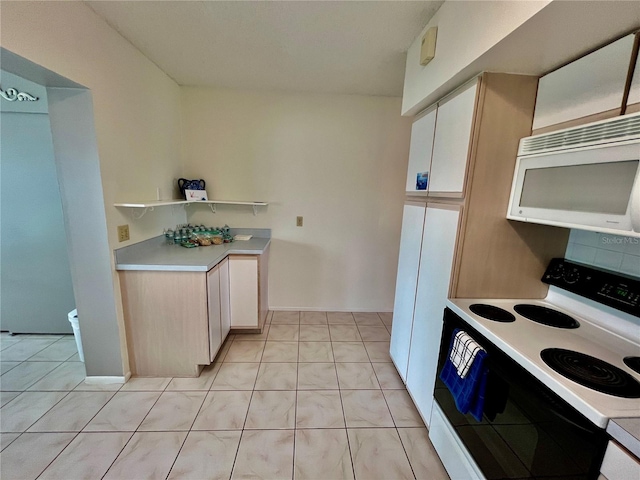 kitchen featuring range with electric cooktop, open shelves, light countertops, light tile patterned floors, and white microwave