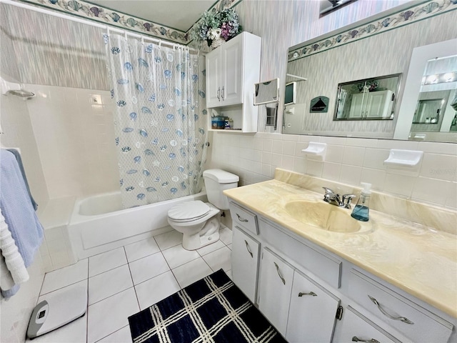 full bath with tile patterned flooring, wallpapered walls, toilet, shower / bath combo with shower curtain, and tile walls