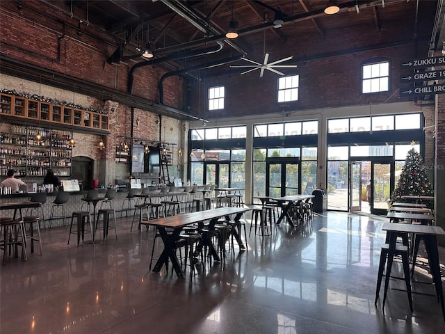 dining room featuring french doors and a high ceiling