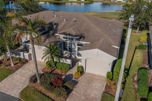 birds eye view of property featuring a water view