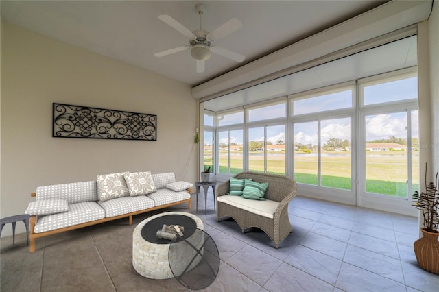 tiled living room with ceiling fan and a wealth of natural light