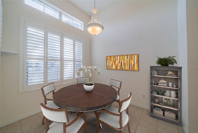 dining area with light tile patterned flooring