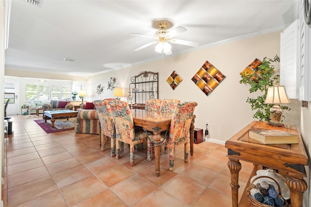 19029 US Highway 19 Unit 25D, Clearwater, FL 33764 - dining area featuring light tile patterned floors, a ceiling fan, and crown molding