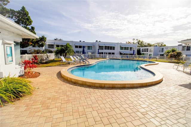 view of swimming pool featuring a patio