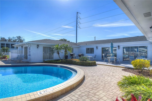 view of pool with a patio