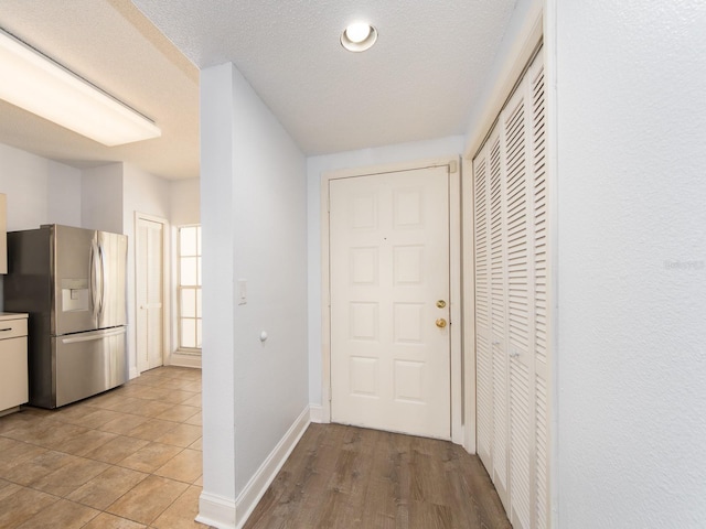 corridor with a textured ceiling