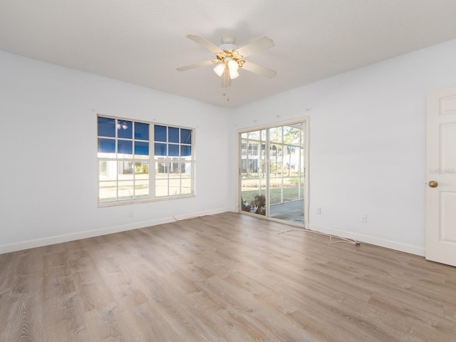 unfurnished room featuring light hardwood / wood-style flooring and ceiling fan