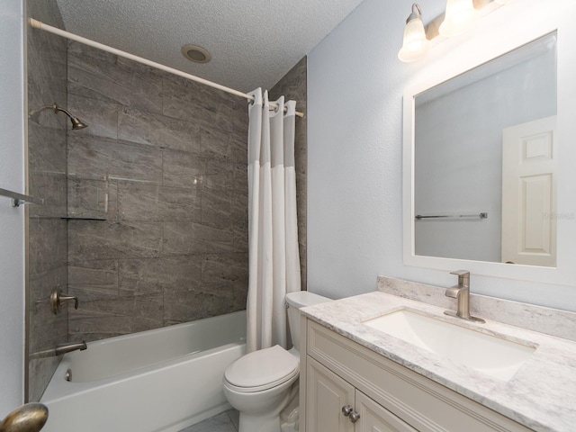 full bathroom featuring vanity, shower / bath combination with curtain, a textured ceiling, and toilet