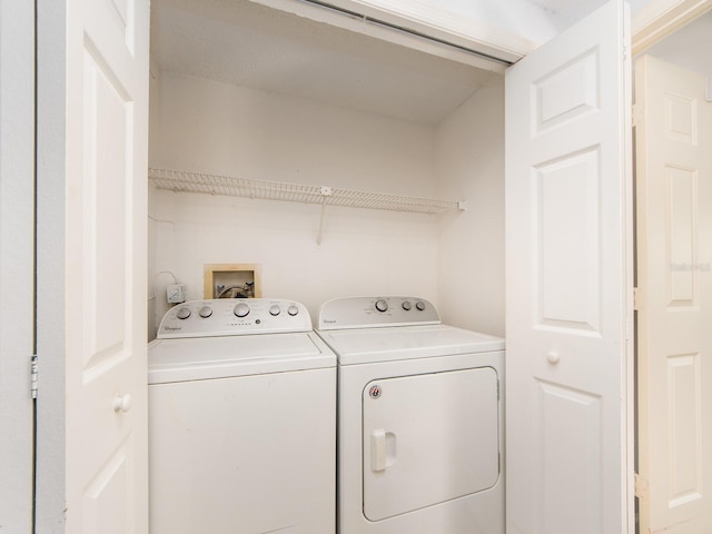 laundry room featuring washer and clothes dryer