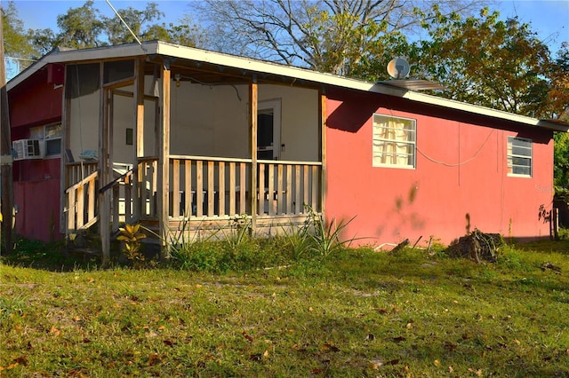 view of home's exterior featuring a yard and cooling unit