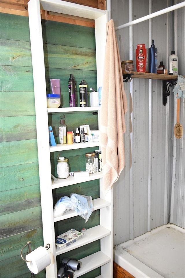 bathroom with wood walls