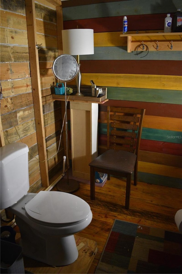 bathroom with wood-type flooring and toilet