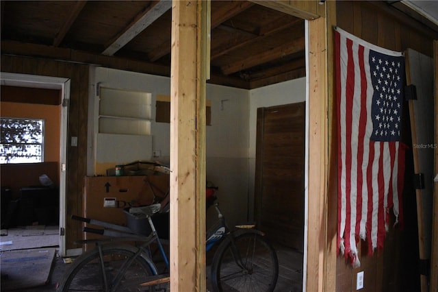 miscellaneous room featuring wooden walls