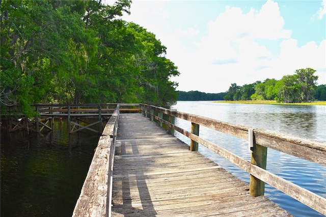 view of dock with a water view