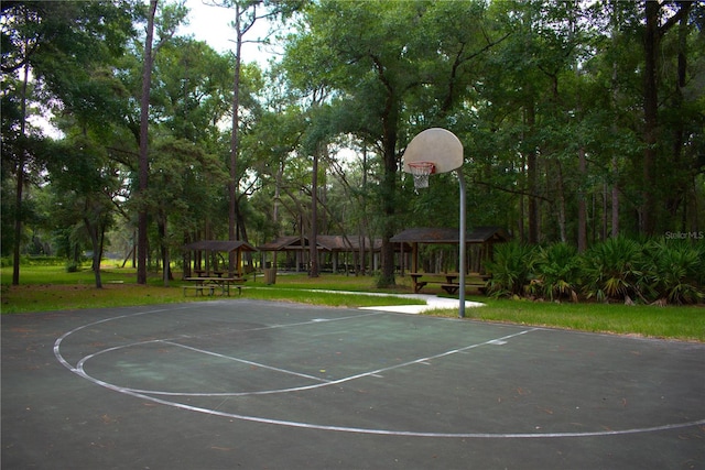 view of sport court featuring a gazebo and a lawn