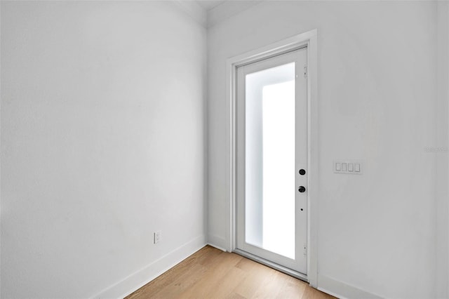 doorway with light wood-type flooring