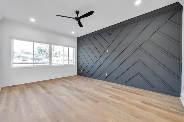 unfurnished room featuring ceiling fan, ornamental molding, and light hardwood / wood-style floors