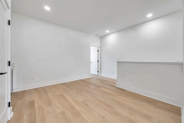 unfurnished room featuring light hardwood / wood-style flooring