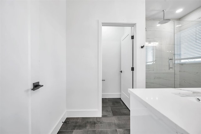 bathroom featuring an enclosed shower