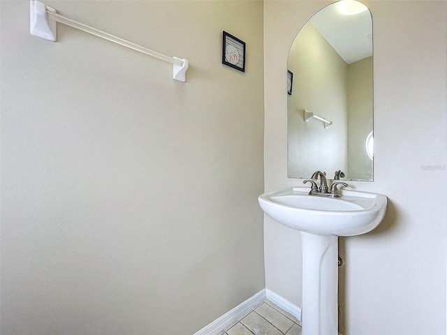 bathroom with tile patterned floors