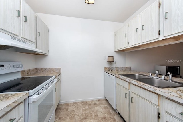 kitchen with sink and white appliances