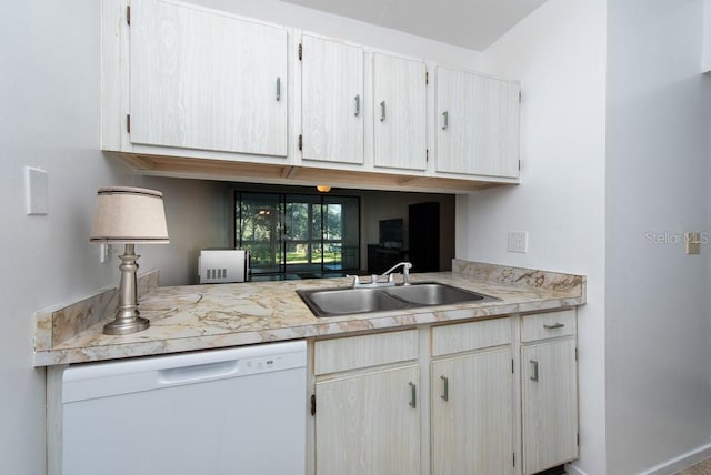 kitchen with white dishwasher, light brown cabinets, and sink