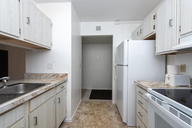 kitchen featuring electric range, light brown cabinets, and sink