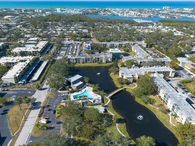 birds eye view of property with a water view